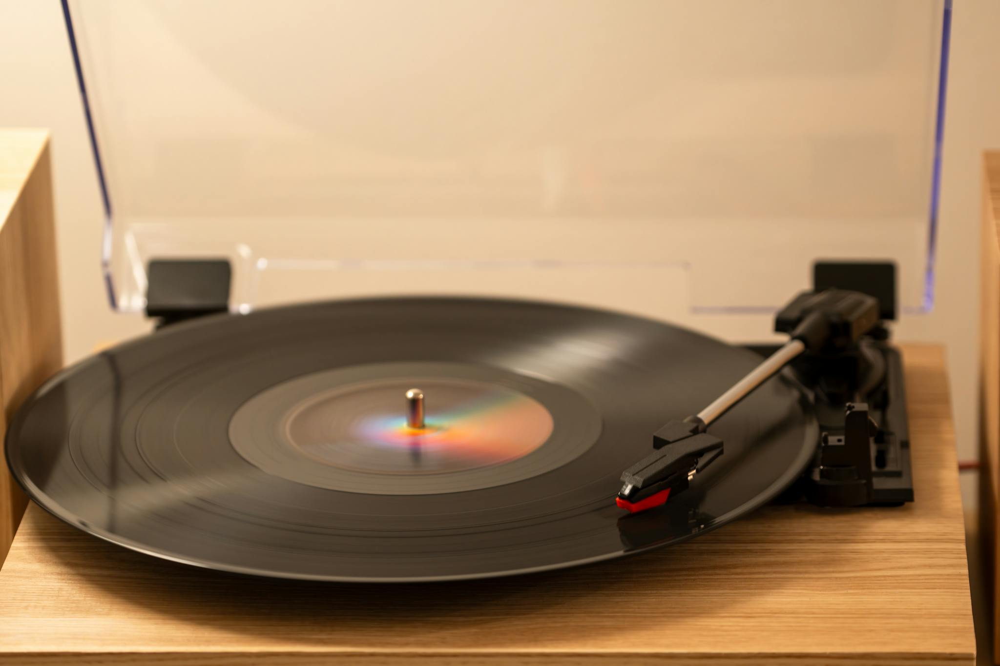 Close-up of a classic turntable playing a vinyl record for a retro audio experience.