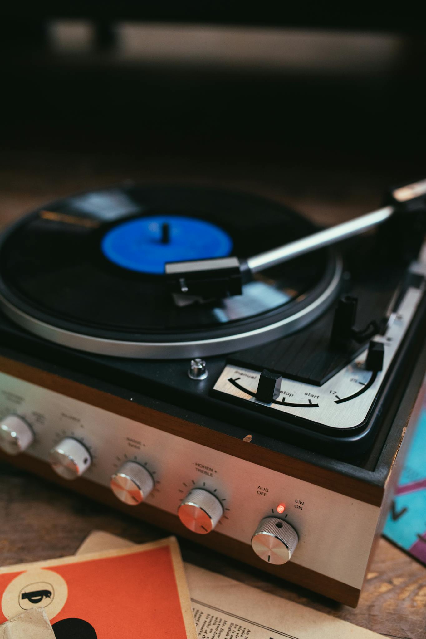 Close-up of a vintage turntable playing a vinyl record, capturing the nostalgia of analog music.